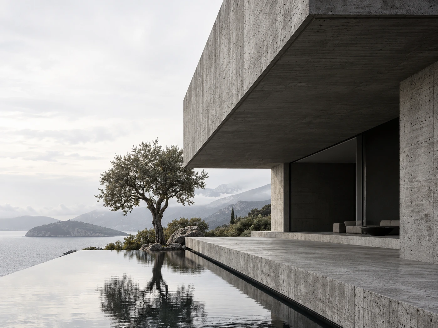 Sculptural concrete architecture overlooking a quiet landscape